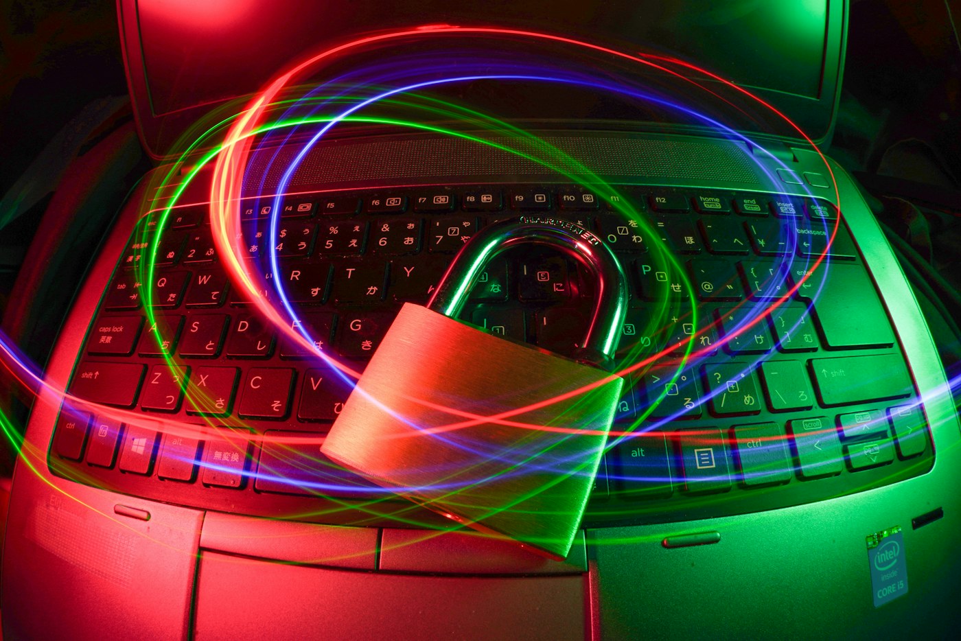 padlock on laptop with light trails. Illustrative photograph; not a depiction of the named product or organisation.
